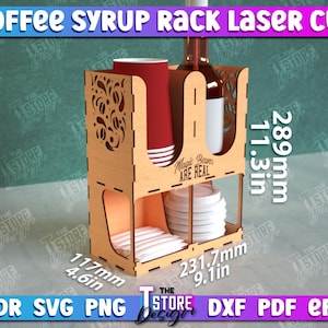 May include: Laser cut wooden coffee syrup rack with a decorative design. The rack has two shelves for storing bottles and cups, and a bottom shelf for storing napkins. The rack is 11.3 inches tall, 9.1 inches wide, and 4.6 inches deep. The text "Magic Beans Are Real" is printed on the front of the rack.