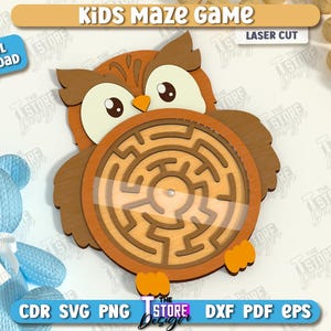 May include: A wooden owl-shaped maze game for kids. The owl has a brown body, large eyes, and a circular maze in the center. The words "Kids Maze Game" and "Laser Cut" are at the top. A blue teddy bear is on the left.