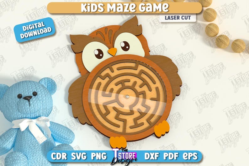 May include: A wooden owl-shaped maze game for kids. The owl has a brown body, large eyes, and a circular maze in the center. The words "Kids Maze Game" and "Laser Cut" are at the top. A blue teddy bear is on the left.