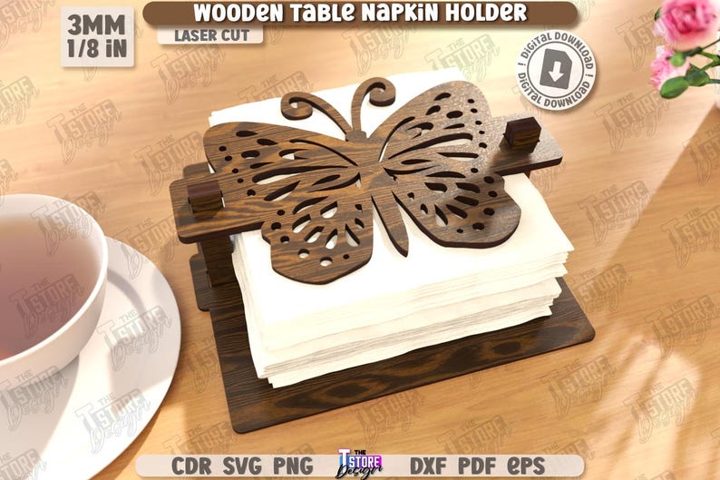May include: Wooden table napkin holder with a laser-cut butterfly design. The holder is made of dark brown wood and holds a stack of white napkins. The text "WOODEN TABLE NAPKIN HOLDER" is visible.