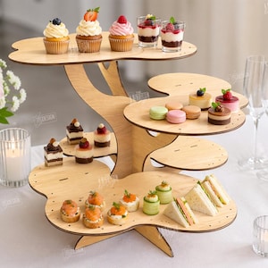 May include: A multi-tiered wooden serving stand, shaped like a tree, displaying various appetizers and desserts. The stand holds cupcakes, mini desserts, macarons, and sandwiches. The text "CUT READY FILE DIGITAL DOWNLOAD" is visible on the right.