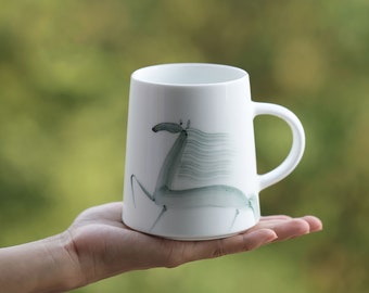 Everyday porcelain mug cup hand painted by the artist with a galloping horse illustration in Indian ink style