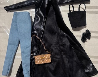 May include: A doll-sized fashion ensemble featuring a black faux leather coat, light blue denim pants, a small black tote bag, black shoes, and a tan quilted purse with a gold chain.