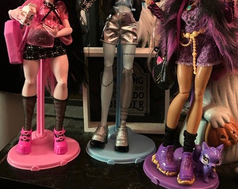 Doll Stands in Different Colors