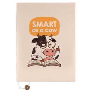 May include: A cream-coloured notebook featuring a cartoon cow wearing glasses and reading a book. The cow is in front of a speech bubble that says "SMART as a cow".