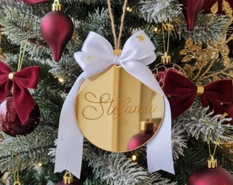 Ball with personalized name engraved on gold mirrored plexiglass with white satin bow and applied gold stars