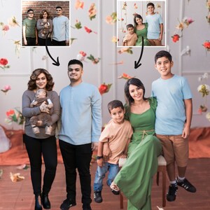 May include: A family portrait with two parents, two children, and a baby. The parents are standing on either side of the baby, who is being held by the mother. The two older children are standing behind the parents. The family is dressed in casual clothing and is smiling. The background is a white wall with a floral pattern.