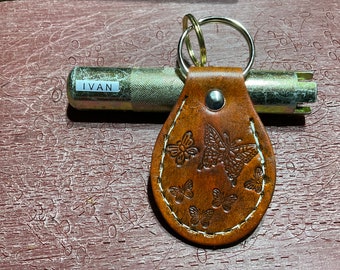 Butterfly  themed leather keychain . Two sided.