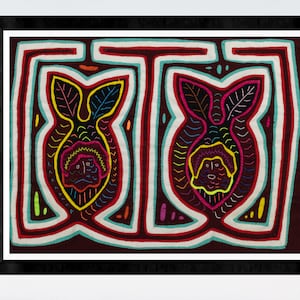 May include: A framed artwork featuring two colourful embroidered figures with intricate designs. The figures are surrounded by a geometric pattern in shades of red, white, and blue.
