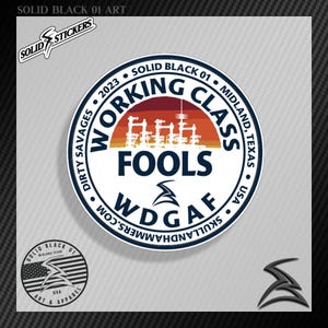 May include: A white round sticker with a blue and red sunset graphic. The text "Working Class Fools" is in blue with the text "WDGAF" in black below. The sticker also includes the text "2023 • Solid Black 01 • Midland, Texas • USA • Dirty Savages"