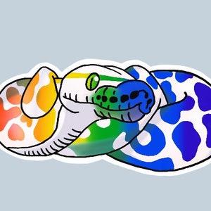 May include: A colorful illustration of a snake curled up in a circle. The snake is white with red, orange, yellow, green, blue, and purple spots. The snake's eyes are green.