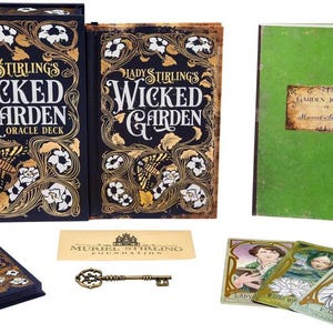 May include: An oracle deck set with a dark blue box and book featuring gold floral designs and the title "Lady Stirling's Wicked Garden." Includes a green journal, cards, a key, and a card with the Muriel Stirling Foundation logo.