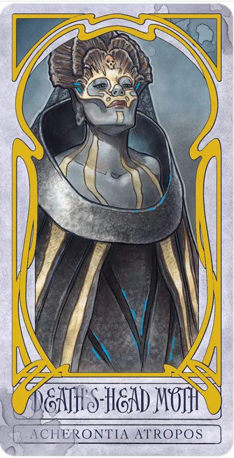 May include: Illustration of a figure with a skull mask, adorned with gold and blue accents, within a yellow Art Nouveau frame. The figure is dressed in a dark cloak with gold stripes. Text at the bottom reads "DEATH'S-HEAD MOTH" and "ACHERONTIA ATROPOS."
