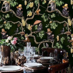 May include: Dark green wallpaper with a quirky design of monkeys in top hats, holding drinks and umbrellas, amongst grape vines and leaves. The backdrop is a deep green, creating a playful and elegant aesthetic.