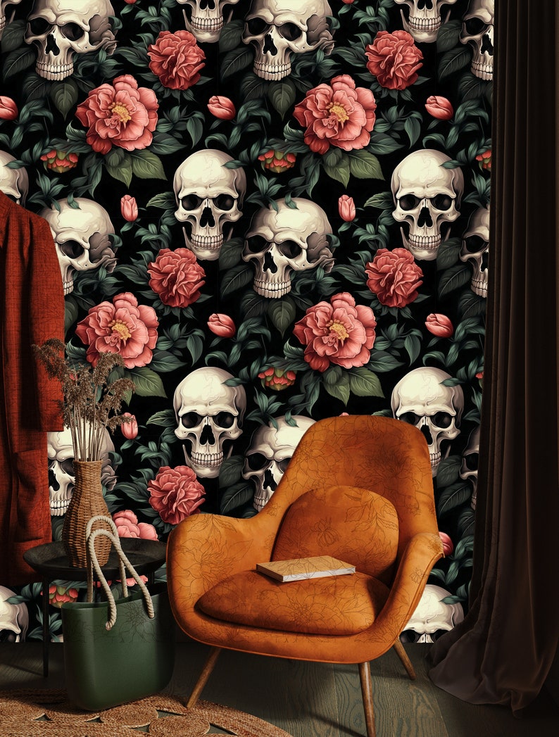 May include: A black and white wallpaper with a repeating pattern of skulls and pink flowers. The wallpaper is in a room with a brown chair and a green bag.