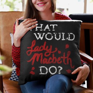 May include: Black throw pillow with white text that reads "What would Lady Macbeth do?" The text "Lady Macbeth" is in red.