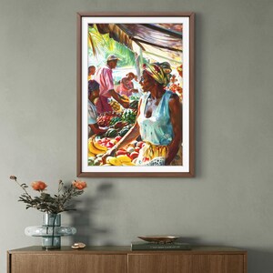 May include: A framed painting depicts a vibrant outdoor market scene. A woman in a blue top and patterned headscarf stands near a table laden with colorful fruits and vegetables. Other figures are visible, creating a bustling atmosphere under a canopy.