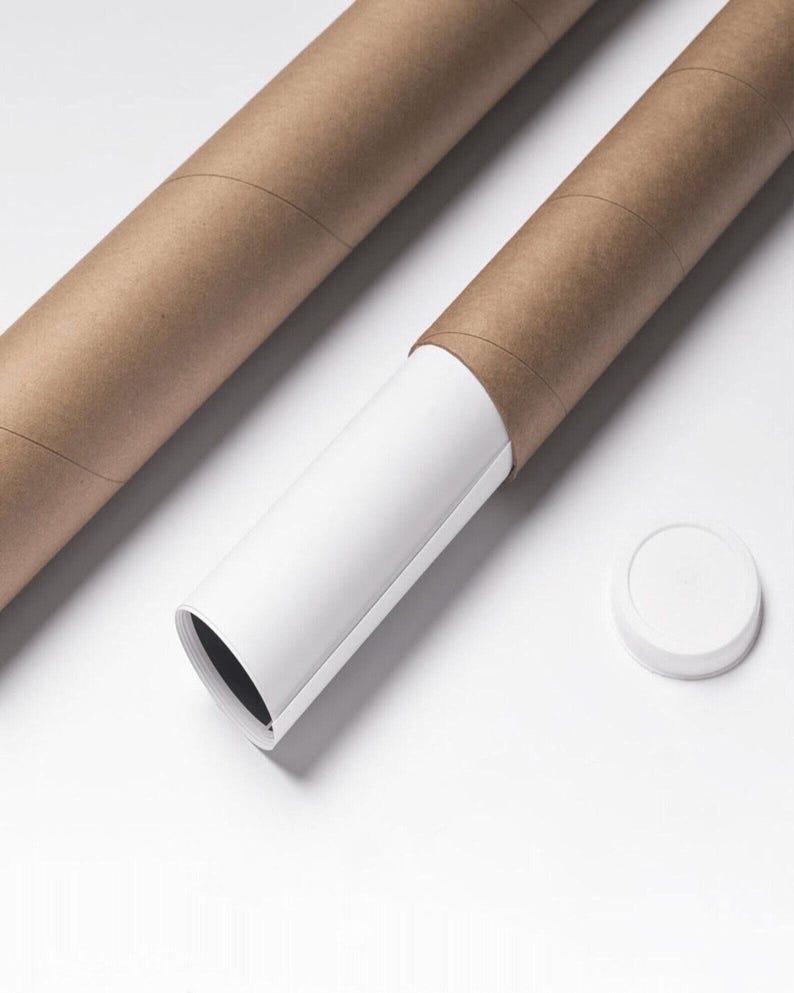 May include: Two brown cardboard tubes, one partially open to reveal a white interior with a rolled-up print. A white cap sits nearby. The tubes are on a white surface.
