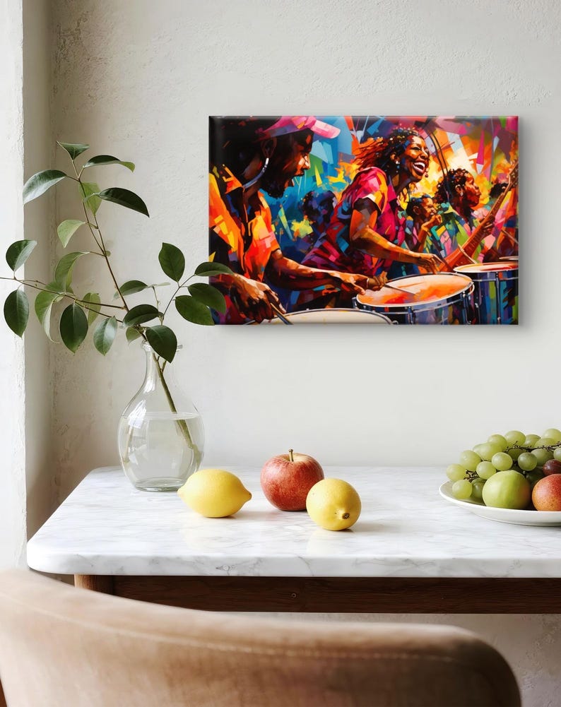 May include: A vibrant, abstract painting depicts a group of people playing drums in a lively, colorful scene. The artwork features bold strokes of orange, red, blue, and yellow, capturing the energy of a musical performance. The painting is displayed on a white wall.