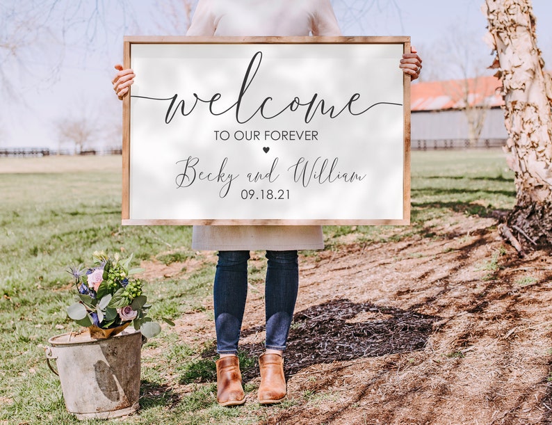 May include: White wooden sign with black calligraphy that reads "Welcome to our forever Becky and William 09.18.21".
