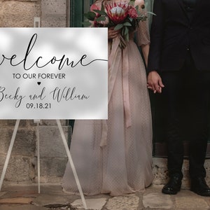 May include: A white welcome sign with black calligraphy that reads "Welcome to our forever Becky and William 09.18.21".