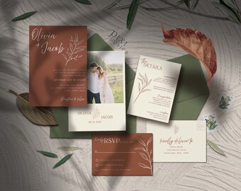 May include: Wedding invitation suite with a rustic theme. The invitation features a brown background with white calligraphy text that reads "Olivia + Jacob". The details card features a beige background with brown text and a simple line drawing of a branch with leaves. The RSVP card features a brown background with a white RSVP form and a line drawing of a branch with leaves.