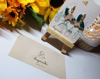 Green floral dino earrings