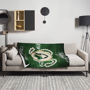 May include: A green throw blanket with a white pearl border and a gold mirror with a floral design. The text "Forever & Always" and the numbers "1929" are printed on the blanket.
