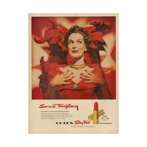 May include: A vintage advertisement for Cutex Stay Fast Lipstick. The ad features a woman in a red dress with a devilish red background. The text reads "Sooo Tempting" and "Cutex Stay Fast Lipstick Never Leaves a Kiss-print". The lipstick is red and gold and the price is 59p or 29p plus tax.