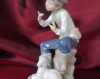 NAO Lladró Porcelain Figurine – Boy sitting on bench with dog. Vintage Collectible.