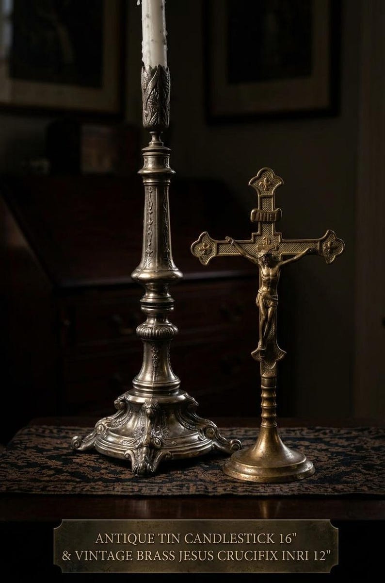 May include: A 16-inch antique tin candlestick with an ornate base and a 12-inch vintage brass Jesus crucifix featuring the INRI inscription. The text at the bottom reads: ANTIQUE TIN CANDLESTICK 16" & VINTAGE BRASS JESUS CRUCIFIX INRI 12".