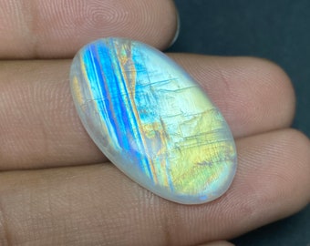 Un cabochon de pierre de lune arc-en-ciel multi-feu de qualité unique, de forme ovale, poli à la main, taille de pierre précieuse en vrac - 18 x 31,50 x 6 mm. Pierres précieuses au prix de gros..