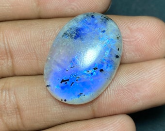 Ultimate - White Rainbow Moonstone Blue Flashy Cabochon With Black Spotted Size - 21x28.50x7.50 MM. Gemstone Oval Shape For Making Jewelry..