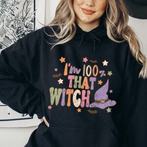 May include: Black hoodie with a colorful graphic that says "I'm 100% That Witch" with a witch's hat and stars.