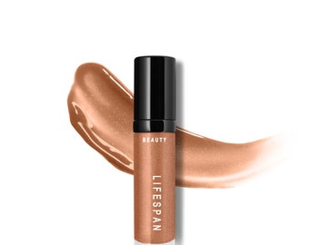 May include: A tube of beauty product with the word "BEAUTY" printed on the top and "LIFESPAN" printed on the body. The product is a bronze color with a black cap. A swatch of the product is next to the tube.