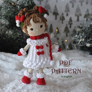 May include: Crochet pattern for a Christmas doll wearing a white dress with red accents, a red scarf, and white boots. The doll has brown hair and a red and white flower crown. The pattern is in English. PDF PATTERN in English.