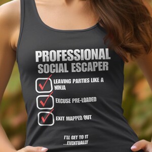 May include: A black tank top with a white graphic that reads "Professional Social Escaper" with a checklist of three items: "Leaving parties like a ninja", "Excuse pre-loaded", and "Exit mapped out". The graphic also includes the text "I'll get to it...eventually".