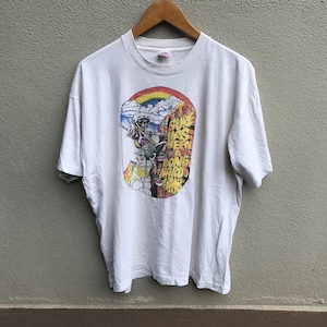 May include: White t-shirt featuring a colorful graphic of a skeleton rock climber with a rainbow and the text "Sure Has Been A Long Hard Climb". The shirt has short sleeves and a crew neck.