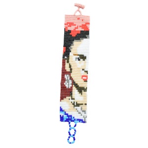 May include: A beaded bracelet featuring a colourful portrait of Frida Kahlo. The bracelet is made with small, colourful beads and has a blue and white design.