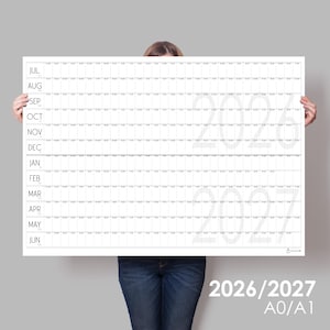 May include: A large horizontal wall calendar for the years 2026 and 2027, featuring a white grid layout with months listed from July to June on the left side. The calendar includes thin black lines for daily tracking and large, faint grey text indicating the years 2026 and 2027 across the centre.