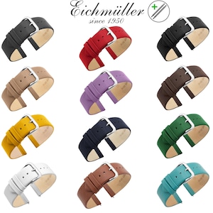 Könnte beinhalten: Eine Auswahl an farbigen Uhrenarmbändern in verschiedenen Farbtönen, darunter Schwarz, Rot, Beige, Lila, Gelb, Marineblau, Grün, Weiß, Braun und Türkis. Jedes Armband hat eine silberne Schnalle und besteht aus glattem Material.