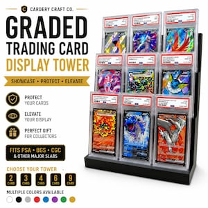 May include: A black tiered display stand holding nine graded trading cards in clear protective slabs. The text on the left reads: GRADED TRADING CARD DISPLAY TOWER, SHOWCASE • PROTECT • ELEVATE, PROTECT YOUR CARDS, ELEVATE YOUR DISPLAY, PERFECT GIFT FOR COLLECTORS, FITS PSA • BGS • CGC & OTHER MAJOR SLABS, CHOOSE YOUR TOWER, 2 3 4 6 9 CARD, MULTIPLE COLORS AVAILABLE.
