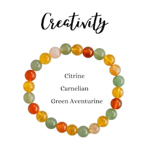 May include: A bracelet made with green aventurine, carnelian, and citrine beads. The bracelet is labeled "Creativity".
