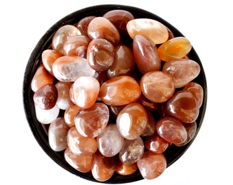 Bulk of Red Crystal Tumbled Stones A Grade Healing Crystals Tumbled Stones in pack sizes of 4oz, 1/2 lb and 1 lb.