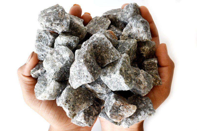 May include: A handful of gray and white rocks, likely used for landscaping or decorative purposes.