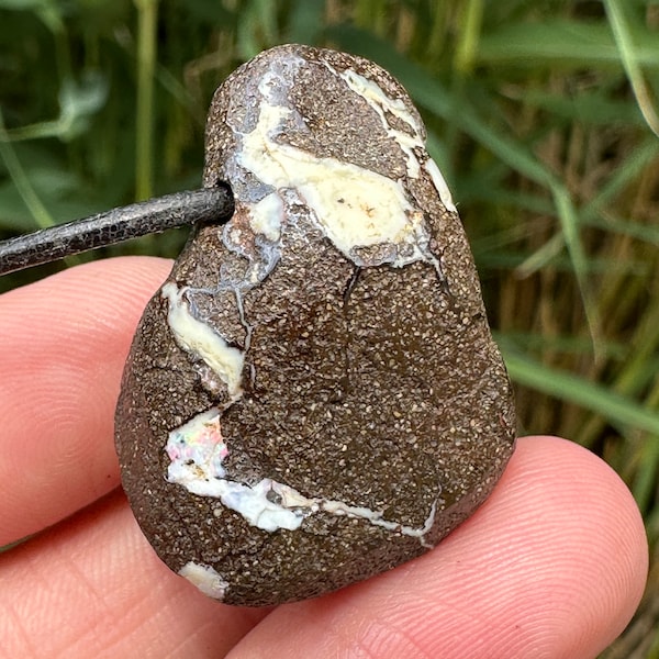 Boulder opal pendant as a protective stone