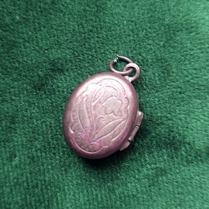 Vintage Victorian gold floral lily mourning remembrance locket with two samples of hair.