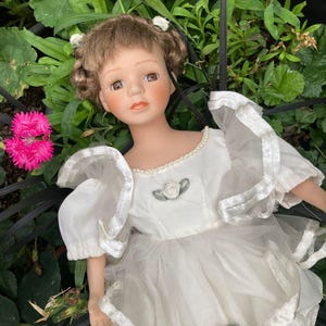 Haunted porcelain ceramic doll Dora.
