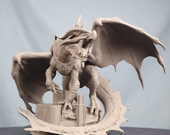 May include: A gray 3D printed dragon figurine with wings spread wide, standing on a castle base. The dragon's mouth is open and its claws are extended.