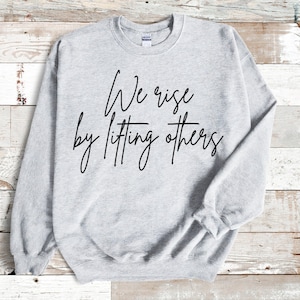 We Rise By Lifting Others PNG & SVG